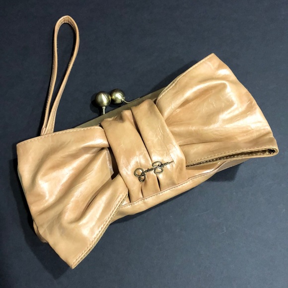 Jessica Simpson Handbags - Jessica Simpson Faux Leather Bow Clutch Wristlet